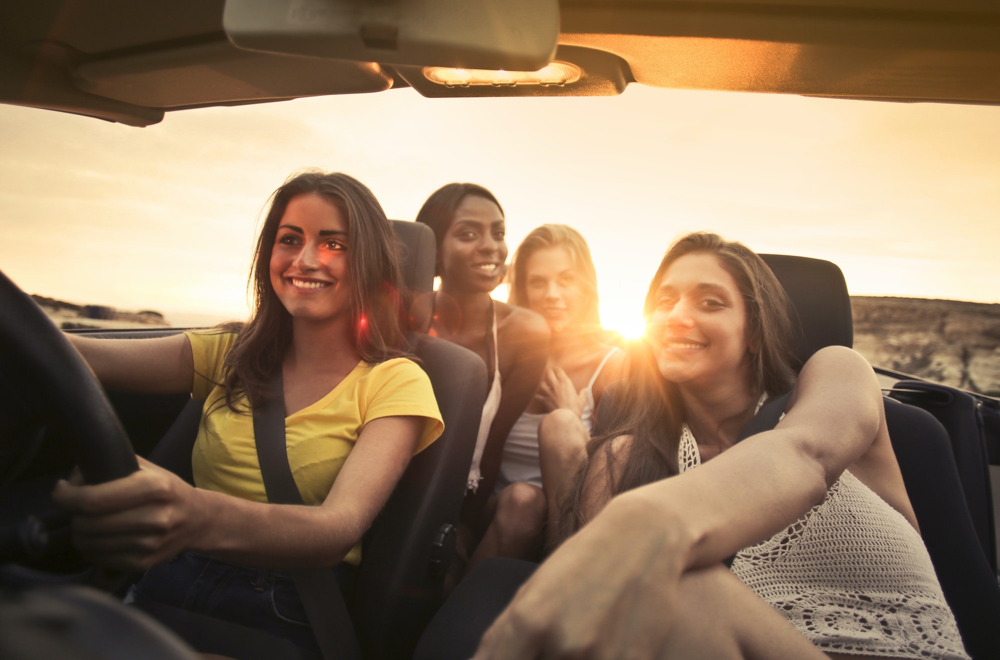 photo of women sitting on car 3753039