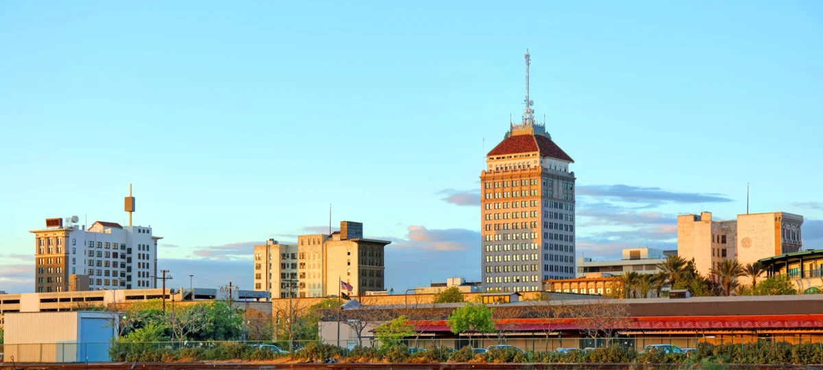 Twilight view of Fresno's downtown skyline showcasing the city's vibrant atmosphere.
